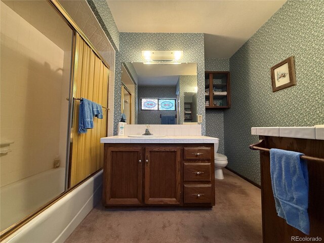 36 Woodchuck Dr, South Fork, CO 81154 - full bathroom featuring vanity, combined bath / shower with glass door, and wallpapered walls