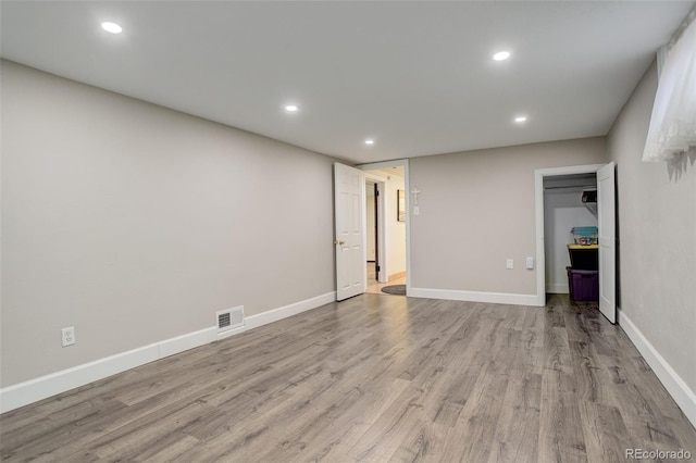 unfurnished bedroom with light wood-type flooring