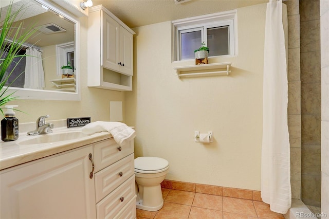 bathroom with vanity, a shower with shower curtain, tile patterned floors, and toilet