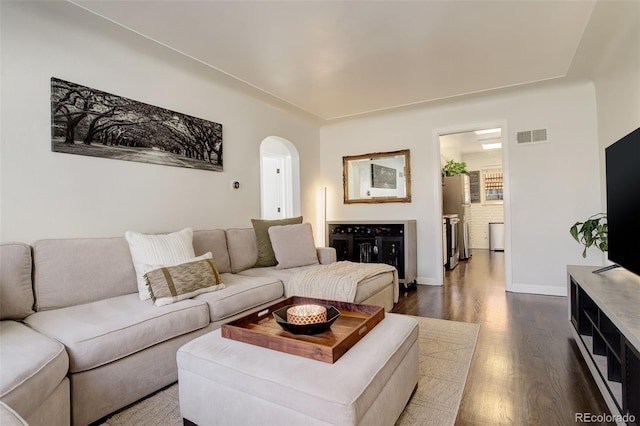 living room featuring dark wood-type flooring