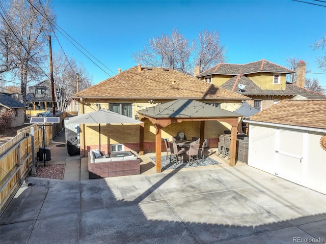 view of front of home with an outdoor hangout area and a patio area