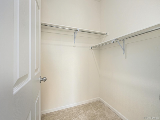 5755 S Buchanan Ct Unit E, Aurora, CO 80016 - spacious closet featuring light colored carpet