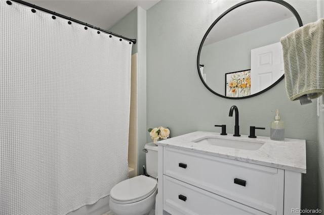 bathroom with toilet, vanity, and shower / bath combination with curtain