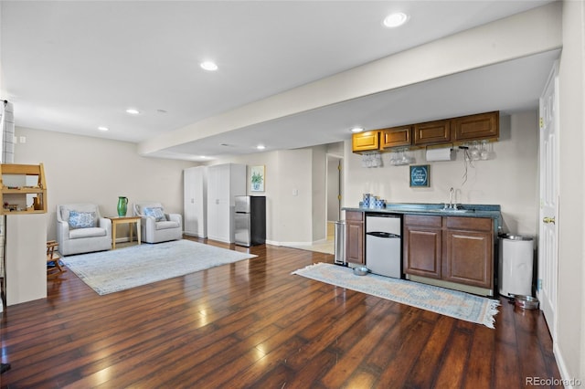 kitchen featuring fridge, dark wood-style flooring, freestanding refrigerator, recessed lighting, and baseboards