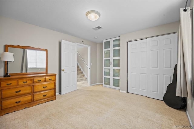 unfurnished bedroom with carpet flooring, a closet, and baseboards