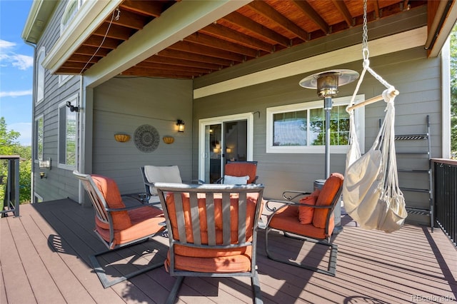 wooden deck featuring outdoor dining area