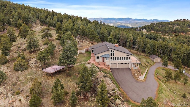 5197 Bear Mountain Dr, Evergreen, CO 80439 - drone / aerial view with a mountain view and a view of trees