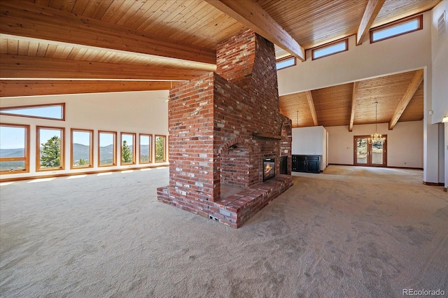 5197 Bear Mountain Dr, Evergreen, CO 80439 - unfurnished living room with beamed ceiling and carpet flooring