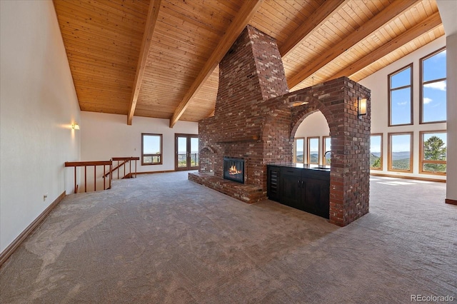 5197 Bear Mountain Dr, Evergreen, CO 80439 - unfurnished living room featuring wooden ceiling, a fireplace, carpet floors, and high vaulted ceiling