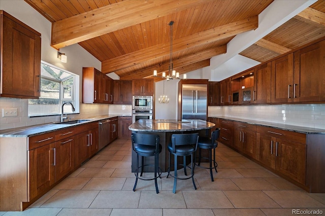 5197 Bear Mountain Dr, Evergreen, CO 80439 - kitchen featuring a chandelier, built in appliances, vaulted ceiling with beams, and a sink