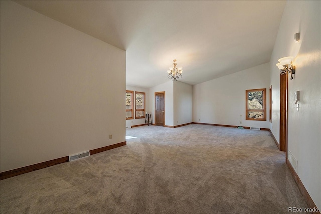 5197 Bear Mountain Dr, Evergreen, CO 80439 - spare room with a chandelier, lofted ceiling, carpet flooring, and visible vents