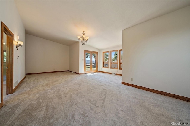 5197 Bear Mountain Dr, Evergreen, CO 80439 - unfurnished room featuring baseboards, a notable chandelier, french doors, and vaulted ceiling