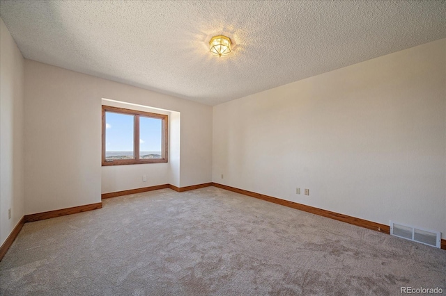 5197 Bear Mountain Dr, Evergreen, CO 80439 - carpeted spare room with a textured ceiling, baseboards, and visible vents