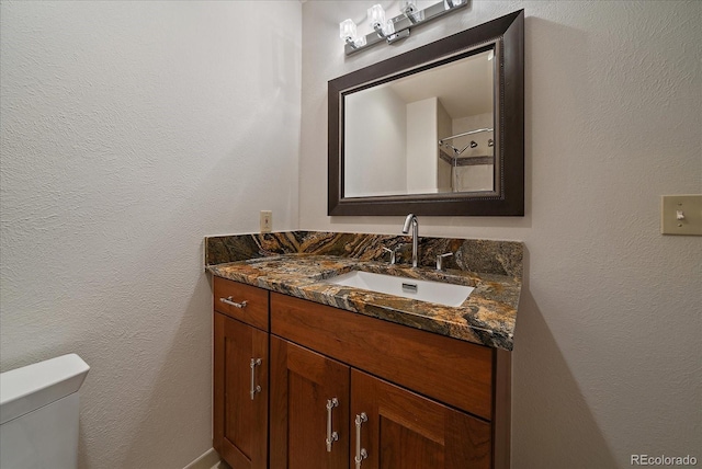 5197 Bear Mountain Dr, Evergreen, CO 80439 - bathroom featuring toilet and vanity