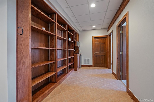 5197 Bear Mountain Dr, Evergreen, CO 80439 - hall with baseboards, a paneled ceiling, light tile patterned floors, and visible vents