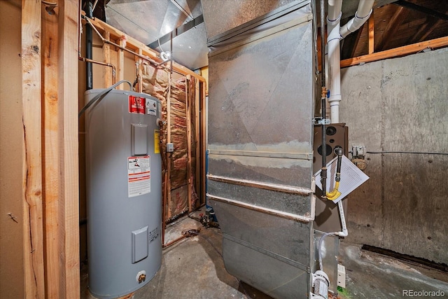 5197 Bear Mountain Dr, Evergreen, CO 80439 - utility room featuring heating unit and electric water heater