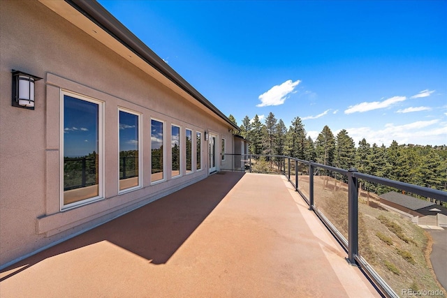 5197 Bear Mountain Dr, Evergreen, CO 80439 - exterior space featuring stucco siding and a balcony