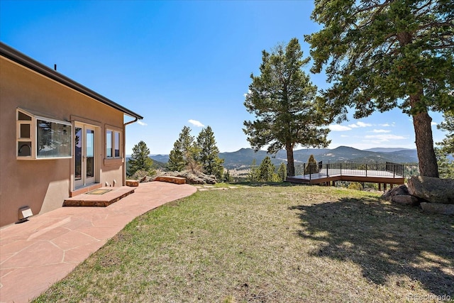 5197 Bear Mountain Dr, Evergreen, CO 80439 - view of yard with a deck with mountain view and french doors