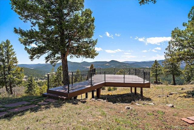5197 Bear Mountain Dr, Evergreen, CO 80439 - view of yard featuring a deck with mountain view
