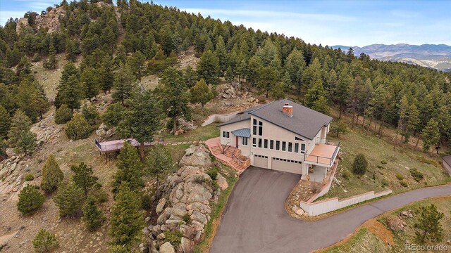 5197 Bear Mountain Dr, Evergreen, CO 80439 - bird's eye view with a forest view and a mountain view