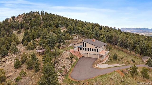 5197 Bear Mountain Dr, Evergreen, CO 80439 - drone / aerial view featuring a forest view