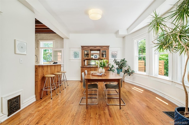 2228 N Race St, Denver, CO 80205 - dining space featuring light wood-style flooring and baseboards