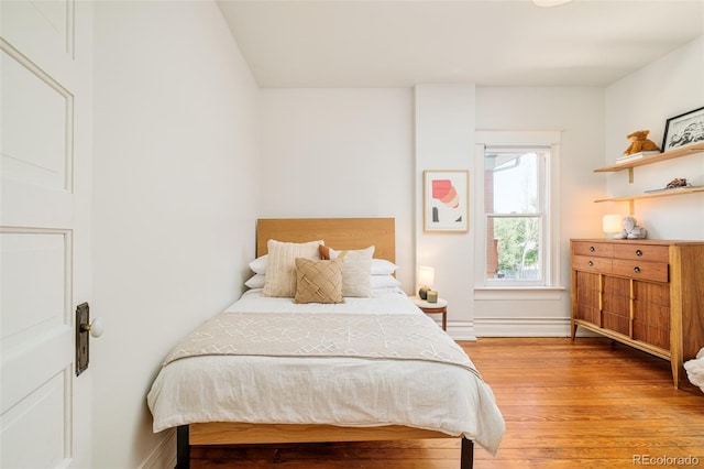 2228 N Race St, Denver, CO 80205 - bedroom featuring light wood finished floors and baseboards