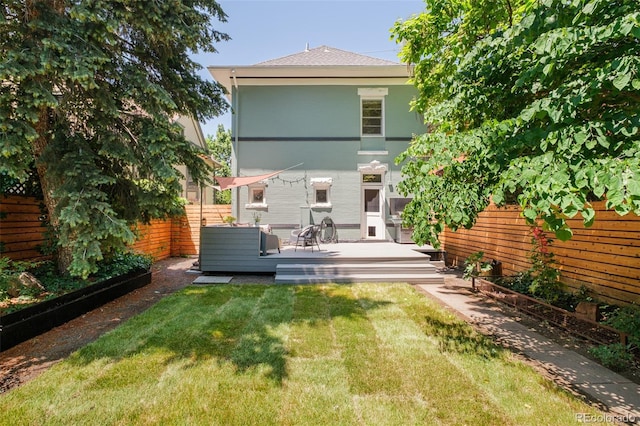 2228 N Race St, Denver, CO 80205 - back of house with a fenced backyard and a deck