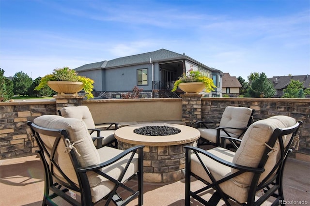 view of patio / terrace with a fire pit