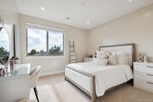 bedroom featuring light colored carpet