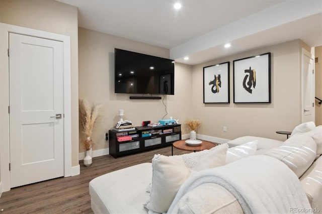 home theater room with dark hardwood / wood-style flooring