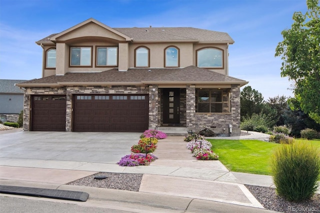 view of front of home with a garage and a front yard