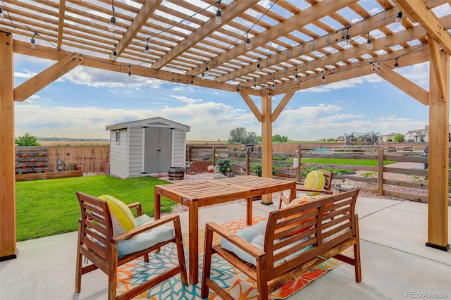 11038 Unity Ln, Commerce City, CO 80022 - fenced backyard with a storage unit, a patio, and outdoor dining space