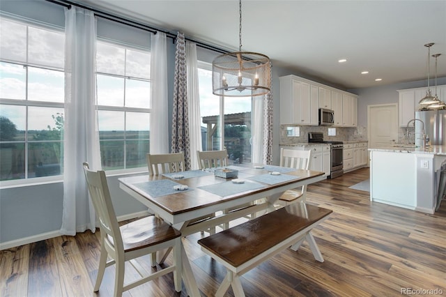 11038 Unity Ln, Commerce City, CO 80022 - dining space with wood finished floors and recessed lighting