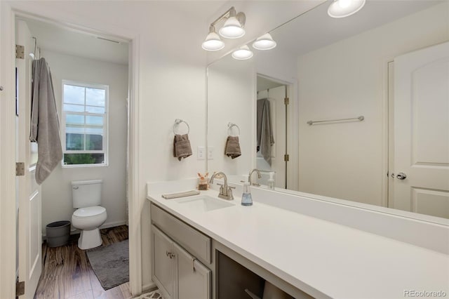 11038 Unity Ln, Commerce City, CO 80022 - full bathroom featuring vanity and wood finished floors