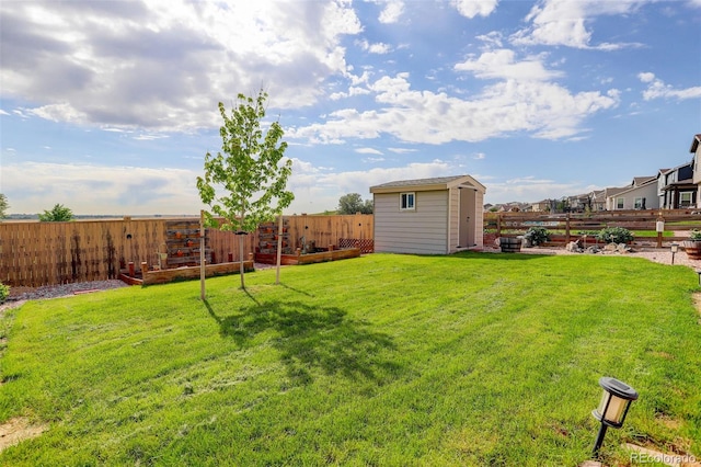 11038 Unity Ln, Commerce City, CO 80022 - fenced backyard with a storage shed and a garden