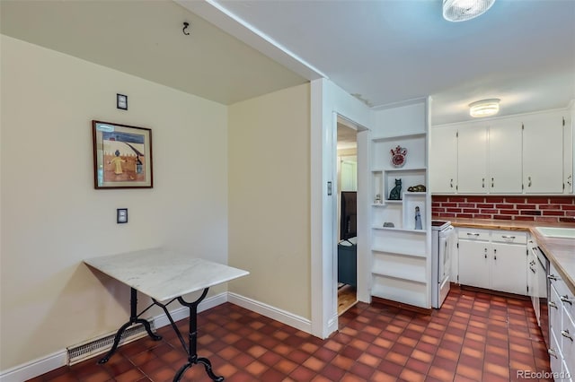 6260 W 45th Pl, Wheat Ridge, CO 80033 - kitchen featuring open shelves, white cabinets, a sink, light countertops, and baseboards