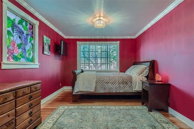 6260 W 45th Pl, Wheat Ridge, CO 80033 - bedroom featuring wood finished floors, baseboards, and ornamental molding