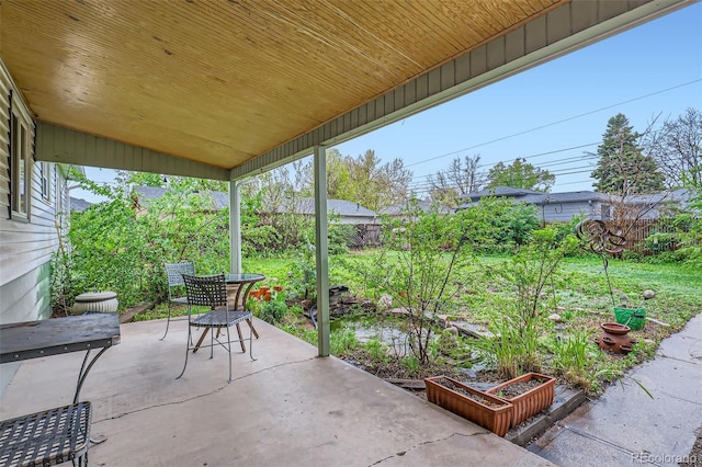 6260 W 45th Pl, Wheat Ridge, CO 80033 - fenced backyard with a patio area and a vegetable garden