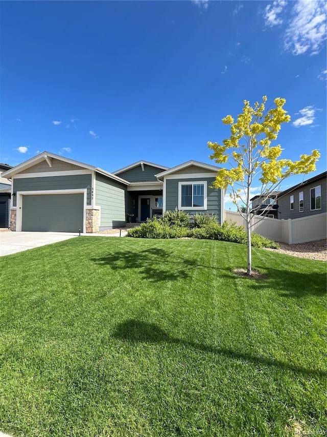 3892 Hackberry St, Wellington, CO 80549 - view of front of house featuring a garage and concrete driveway