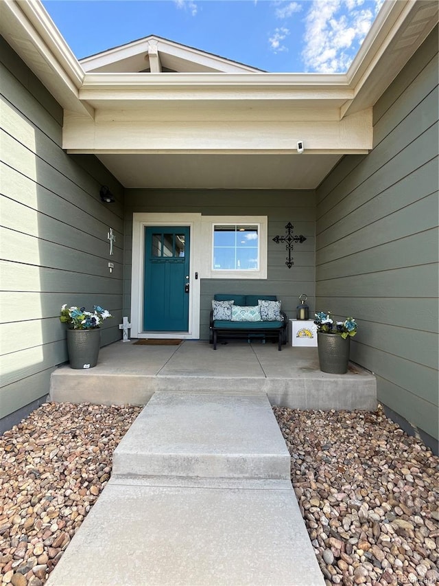 3892 Hackberry St, Wellington, CO 80549 - view of exterior entry featuring an outdoor hangout area and covered porch