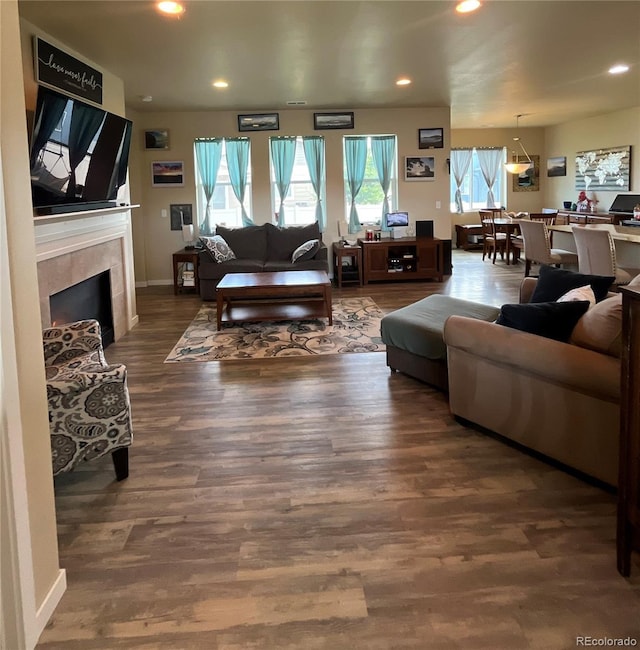 3892 Hackberry St, Wellington, CO 80549 - living room featuring wood finished floors, a fireplace, and recessed lighting