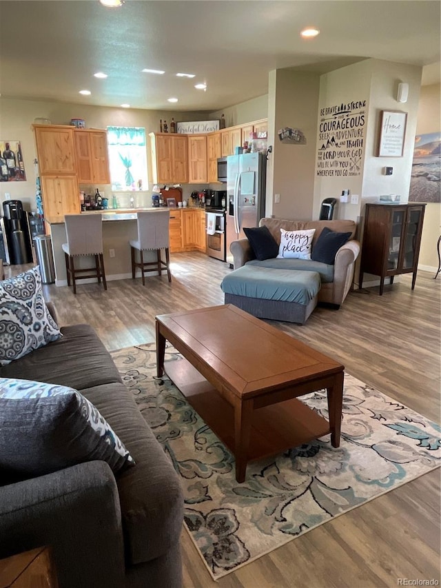 3892 Hackberry St, Wellington, CO 80549 - living area with light wood-style flooring and recessed lighting