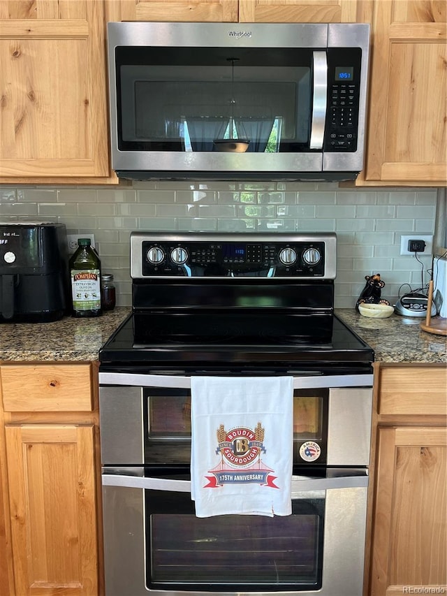 3892 Hackberry St, Wellington, CO 80549 - kitchen with stainless steel appliances, decorative backsplash, and light brown cabinets