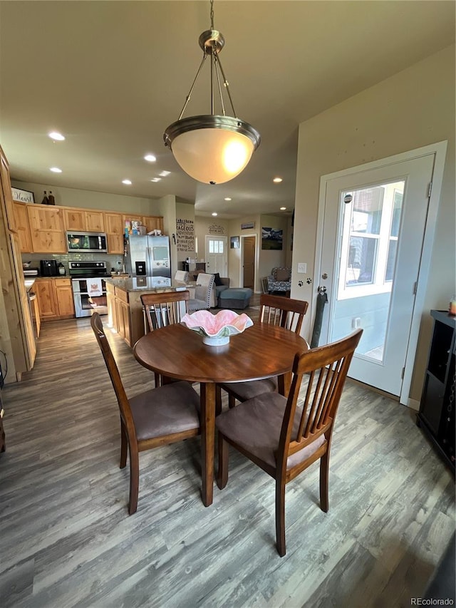 3892 Hackberry St, Wellington, CO 80549 - dining space featuring wood finished floors and recessed lighting