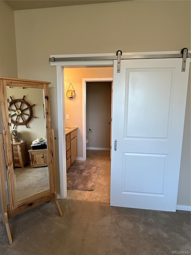 3892 Hackberry St, Wellington, CO 80549 - hall featuring a barn door and carpet flooring