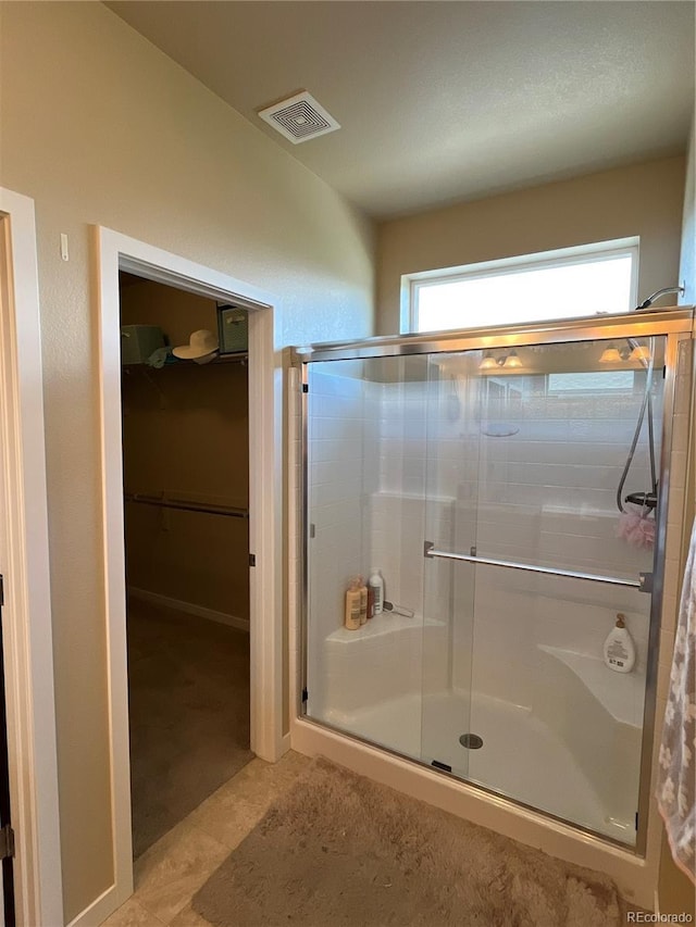 3892 Hackberry St, Wellington, CO 80549 - bathroom featuring a stall shower and a walk in closet