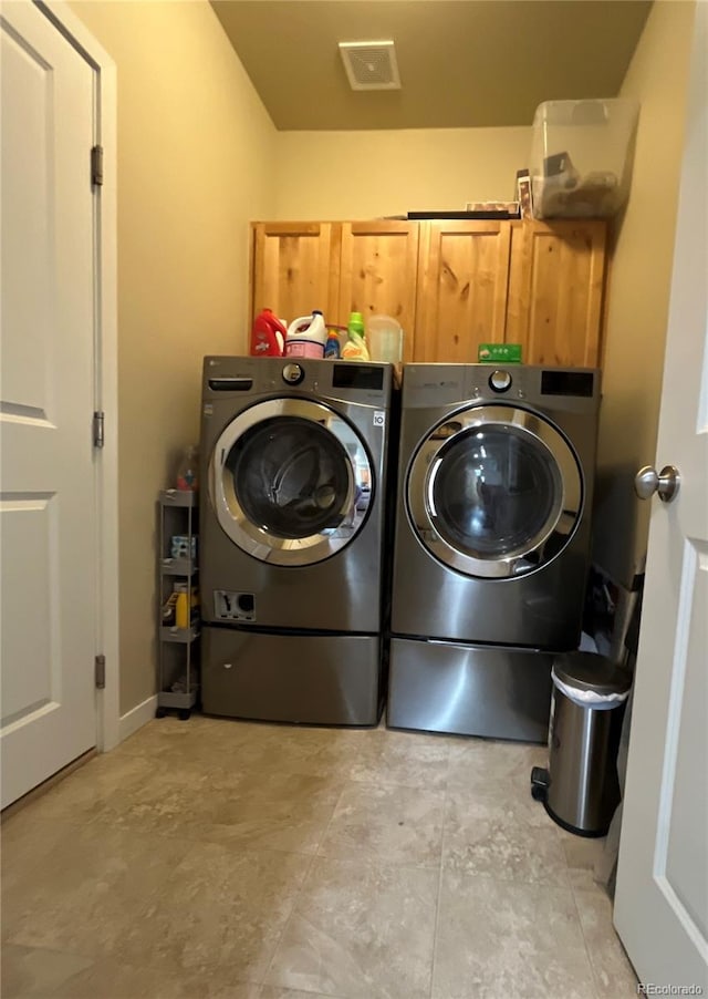3892 Hackberry St, Wellington, CO 80549 - washroom featuring separate washer and dryer and cabinet space