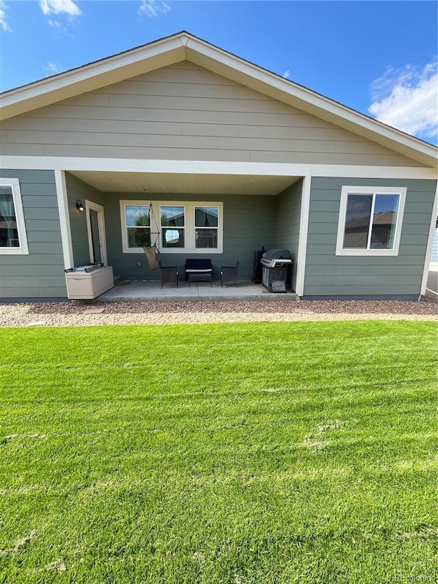 3892 Hackberry St, Wellington, CO 80549 - back of property featuring a yard and a patio