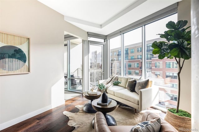 living area featuring wood finished floors and baseboards